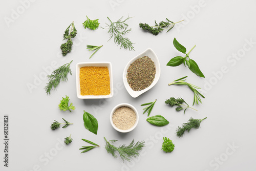 Fototapeta Naklejka Na Ścianę i Meble -  Composition with different herbs and spices on light background