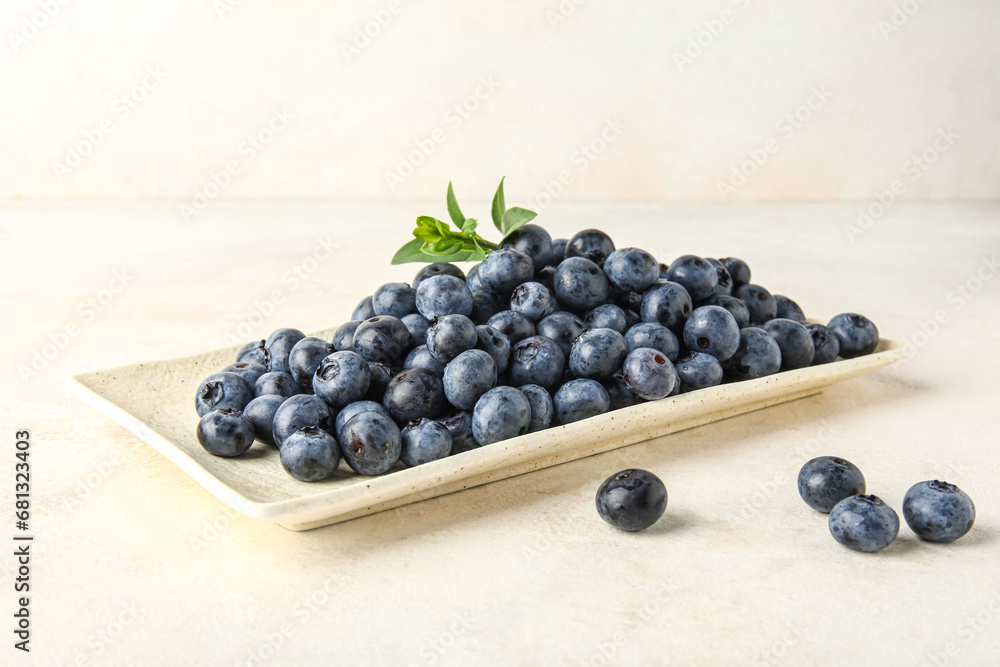 Plate with fresh blueberries on white background Plate with fresh blueberries on white background
