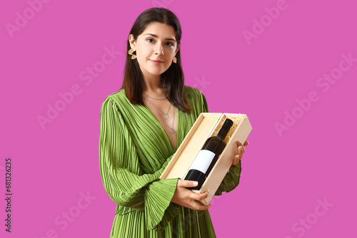 Young woman with bottle of ...