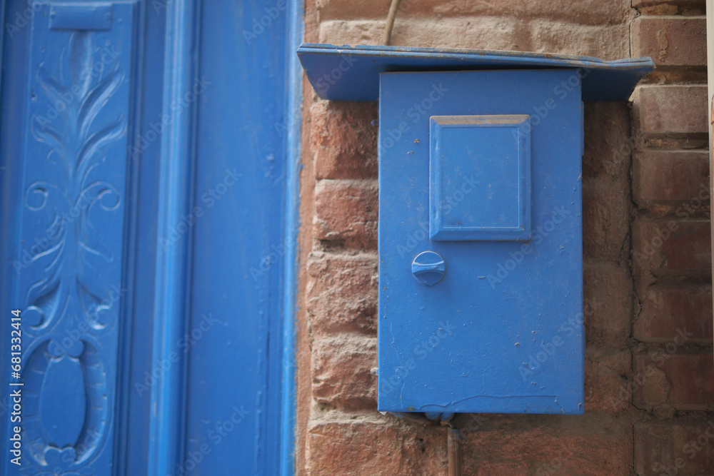 blue color mailbox postbox letter on wall 