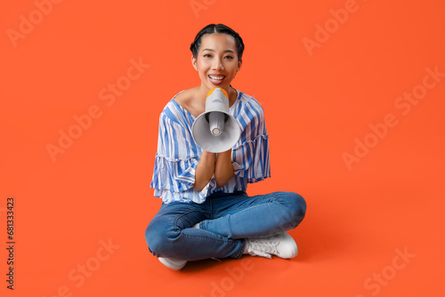 Young Asian woman with mega...