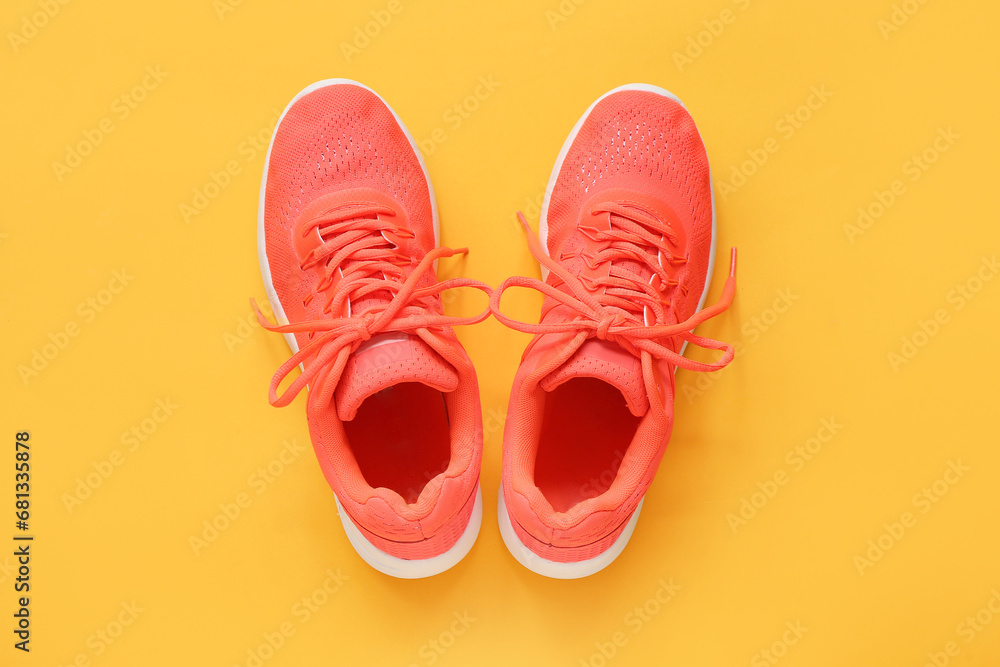 Stylish sneakers on orange background Stylish sneakers on orange background