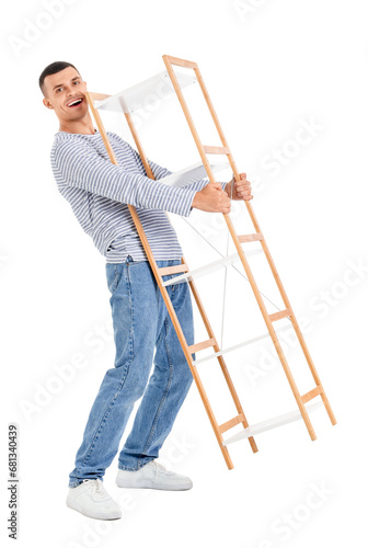 Young man carrying shelf unit on white background