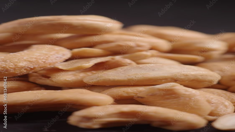 vertical shot of cashew nuts on black background vertical shot of cashew nuts on black background