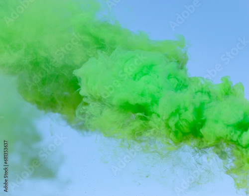 green smoke on a blue background.