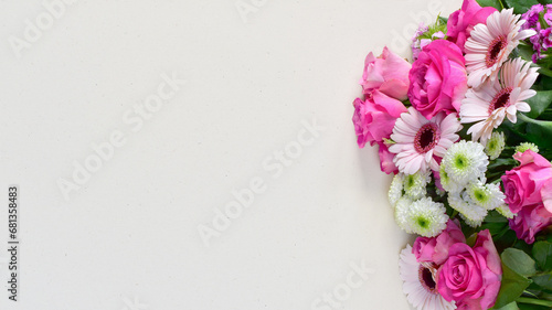 Pink flowers bouquet on blank paper card background, copy space