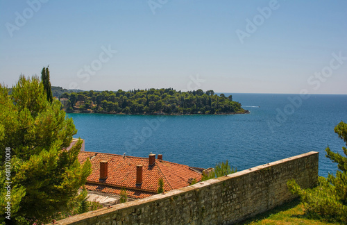 The coast of Rovinj in Istria, Croatia. Viewed from from Saint Euphemia Hill, looking towards Otok Sveta Katarina, Saint Catherine's Island photo