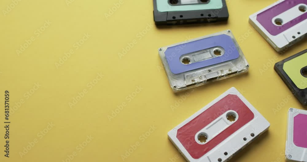 Video of retro tapes with copy space on yellow background Video of retro tapes with copy space on yellow background