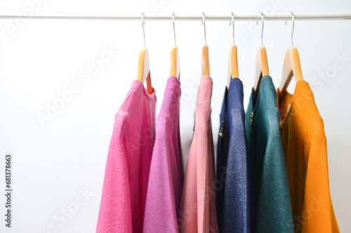 Rack with stylish women's clothes isolated on white background.