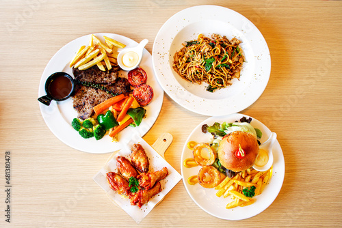 set of food dishes. Top view of chicken fried, hamburger, spaghetti, steak. copy space for your text