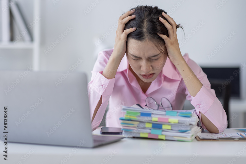 Tired exhausted or sad business young asian woman sleepy and bored from sitting at a desk.tired of working in a laptop, Tired exhausted or sad business young asian woman sleepy and bored from sitting at a desk.tired of working in a laptop,
