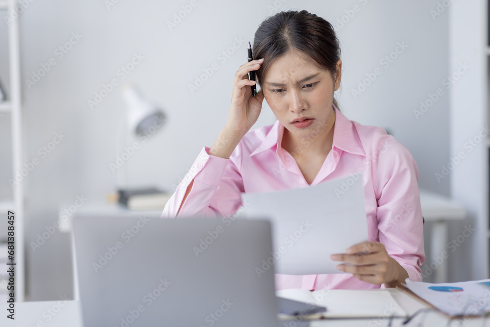 Tired exhausted or sad business young asian woman sleepy and bored from sitting at a desk.tired of working in a laptop, Tired exhausted or sad business young asian woman sleepy and bored from sitting at a desk.tired of working in a laptop,