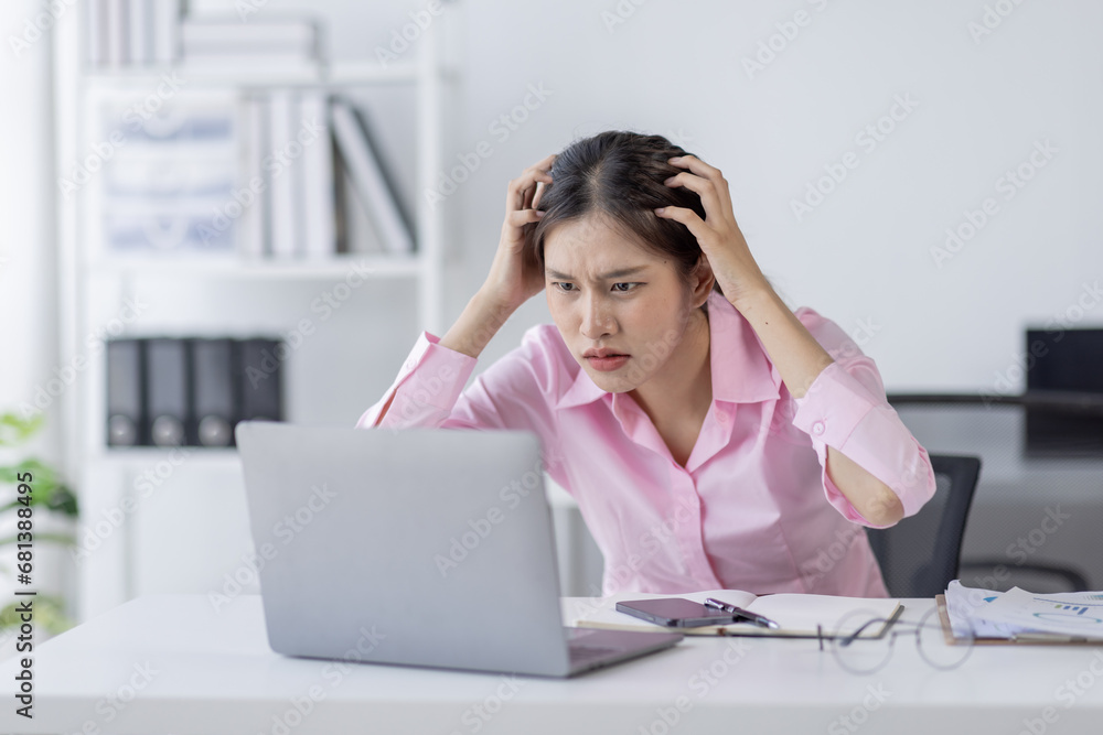 Tired exhausted or sad business young asian woman sleepy and bored from sitting at a desk.tired of working in a laptop, Tired exhausted or sad business young asian woman sleepy and bored from sitting at a desk.tired of working in a laptop,