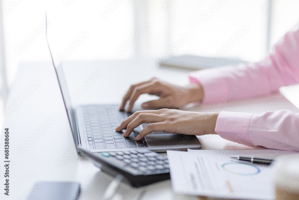 Financial Businesswomen analyze the graph of the company's performance to create profits and growth, Market research reports and income statistics, Financial and Accounting concept. Financial Businesswomen analyze the graph of the company's performance to create profits and growth, Market research reports and income statistics, Financial and Accounting concept.