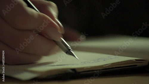 Close-up of fountain pen writing in an old-fashioned paper notebook or diary