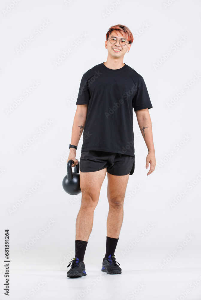 Isolated cutout full body studio shot of strong Asian male fitness athlete sportsman trainer model in casual sport workout outfit lifting kettlebell training exercising stretching on white background Isolated cutout full body studio shot of strong Asian male fitness athlete sportsman trainer model in casual sport workout outfit lifting kettlebell training exercising stretching on white background