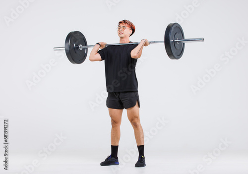 Isolated cutout full body studio shot of strong Asian male fitness athlete sportsman trainer model in casual sport workout outfit lifting barbell training exercising deadlift on white background