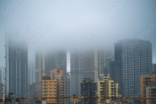 Aerial view of Mumbai city in Maharashtra, India. Beautiful cloudy weather during monsoon. Indian Cityscape.