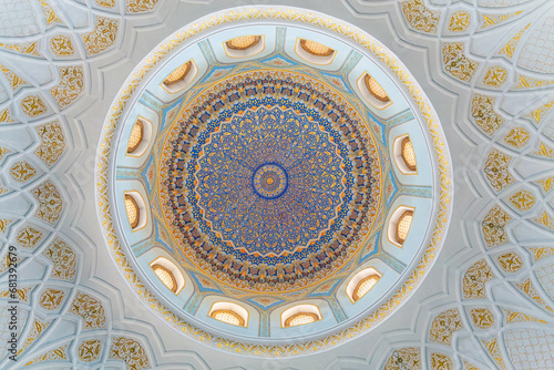 Painted gilded dome of Hazrati Imam mosque. Blue, gold and cyan concentric ornament with floral element. Tashkent, Uzbekistan