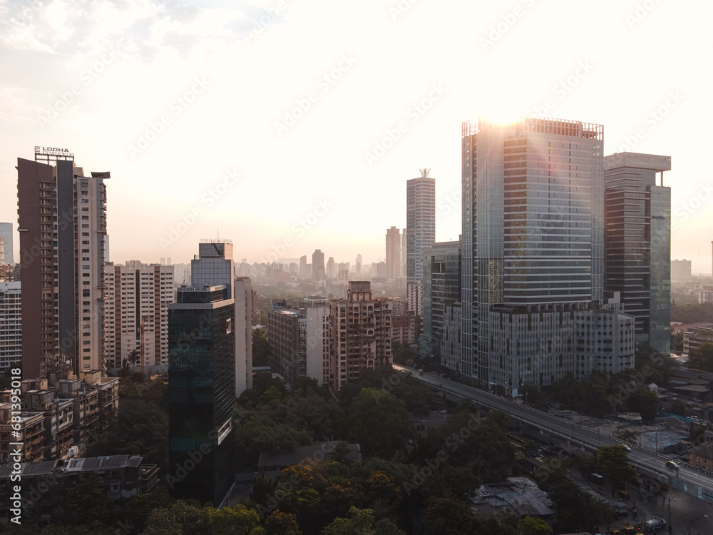 Silhouette View of sunset behind Modern City high-rise skyscraper buildings in Mumbai City, beautiful yellow evening shot. Silhouette View of sunset behind Modern City high-rise skyscraper buildings in Mumbai City, beautiful yellow evening shot.