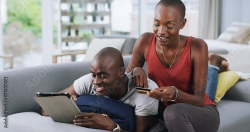 Tablet, love and couple on a sofa with credit card for bank, loan or ecommerce payment at home. Digital, app and black people on a living room for online shopping, search or sign up, password or deal