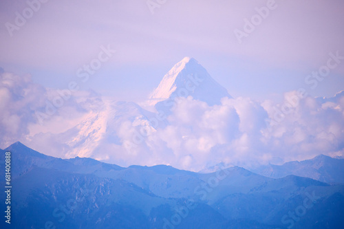 Khan-Tengri peak . Khan Tengri is a mountain of the Tian Shan mountain range. Khan Tengri is a massive marble pyramid, covered in snow and ice.  © Yerbolat