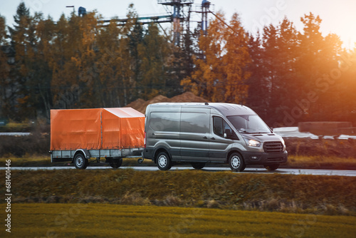 Wallpaper Mural A Car and a Rental Trailer on a Curvy Road. A Smart Way to Move Your Stuff. Transporting Cargo with a Car and a Trailer. A Convenient and Cost-Effective Solution. Torontodigital.ca