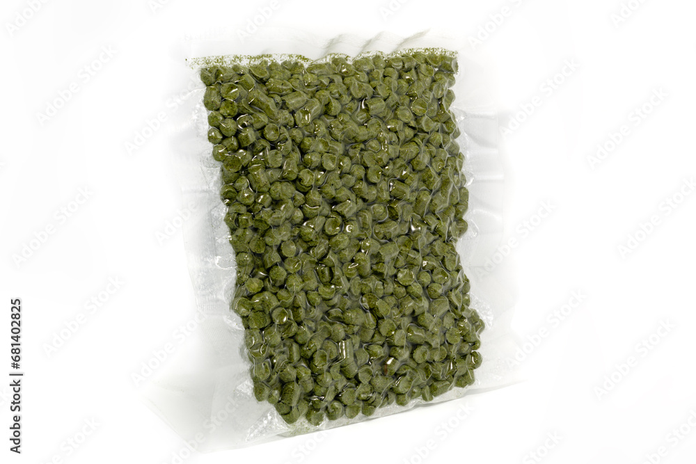 Green hop granules packed in transparent packaging