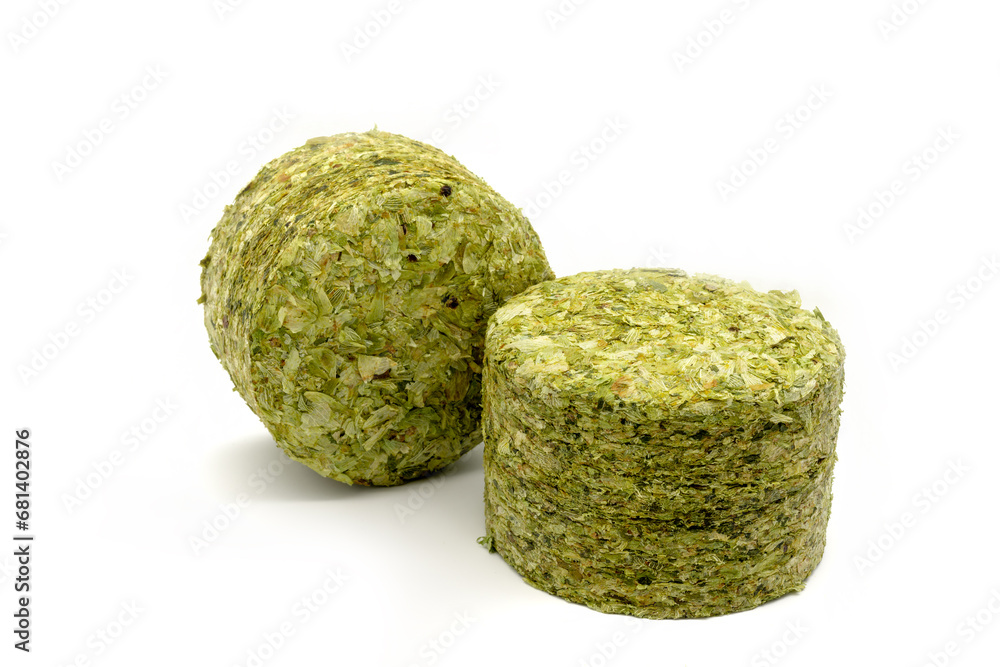 Obraz premium Dried hops - pressed hop pucks photographed on white background - Czech hops from the Žatec region - Czech Republic, Europe