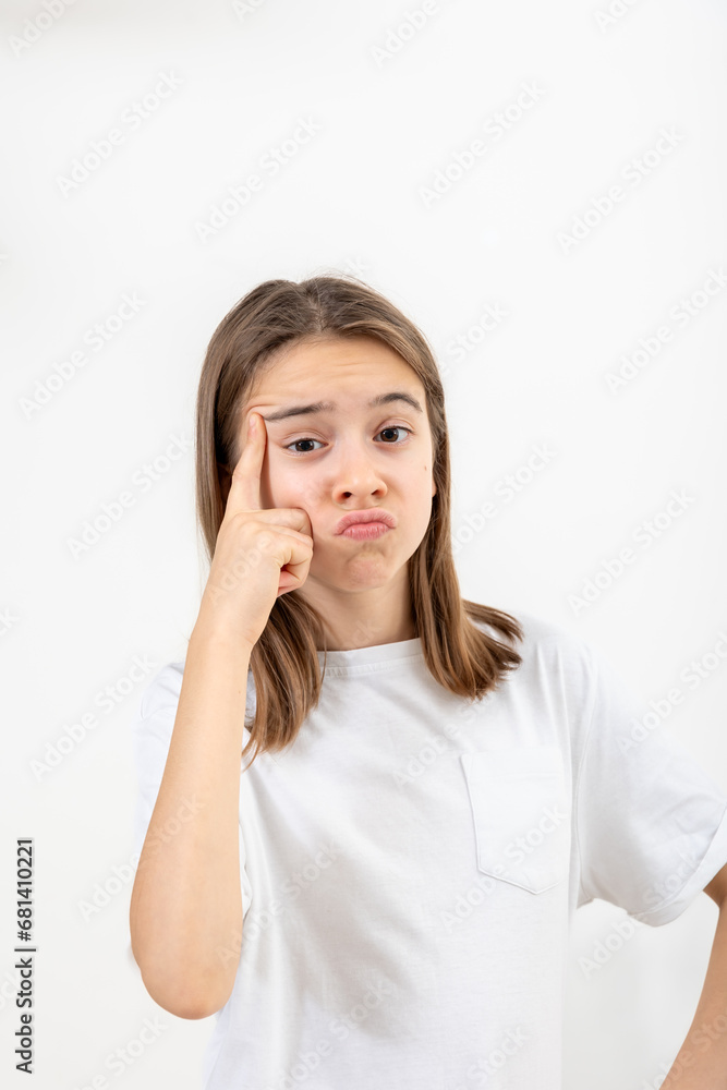 Little girl thinking, holding finger at temple, isolated on white background. Little girl thinking, holding finger at temple, isolated on white background.