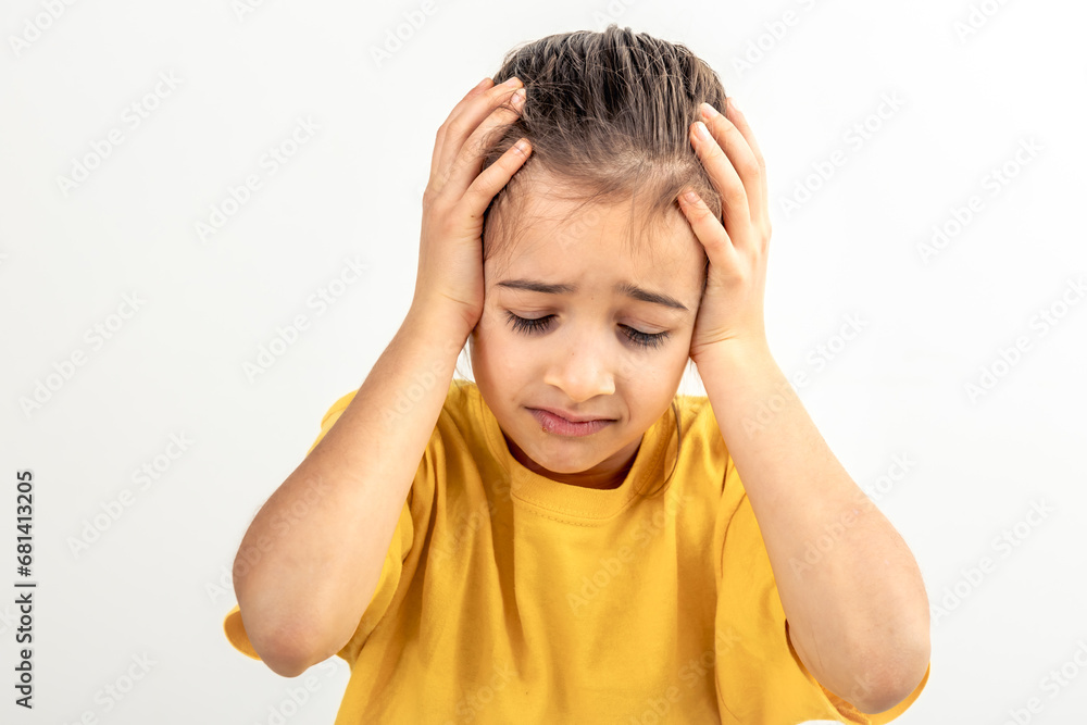 Little desperate girl looking panic, holding her head with both hands. Little desperate girl looking panic, holding her head with both hands.