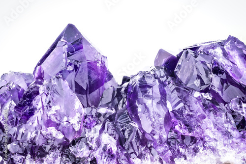 amethyst druse with white background. macro detail texture background. close-up raw rough unpolished semi-precious gemstone photo