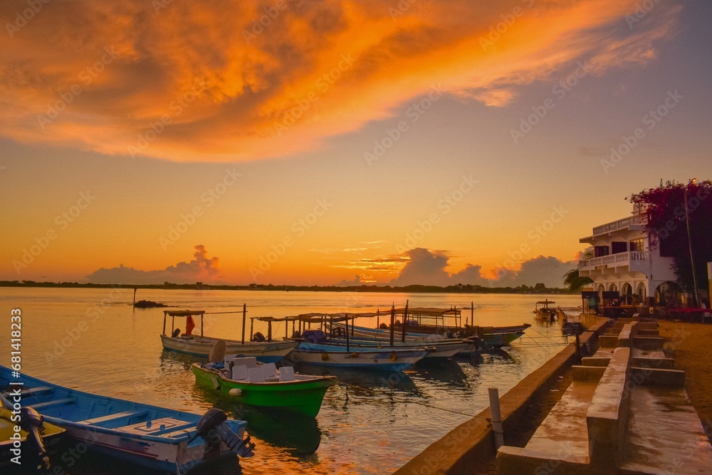 Fototapeta premium Boats against beach front properties at sunset in Shela Beach, Lamu Isand, Kenya