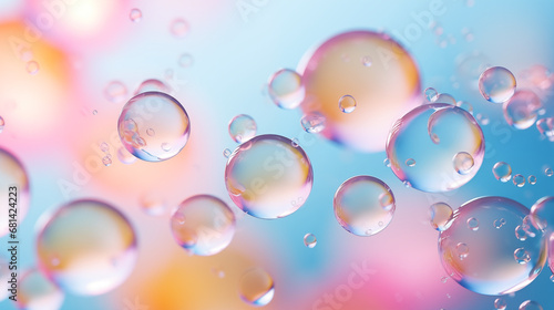 Water droplets floating on a pastel background.