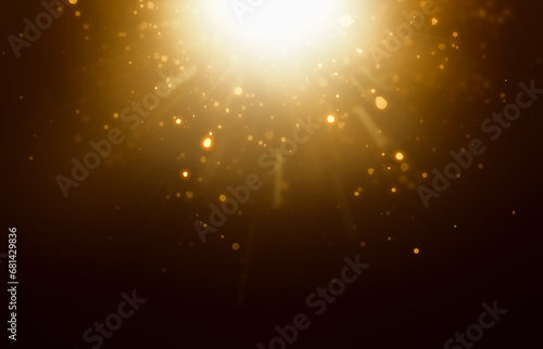 gold dust and particles falling from a flash of light