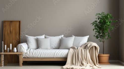 single white sofa with pillows and blanket against blank wall, modern interior design