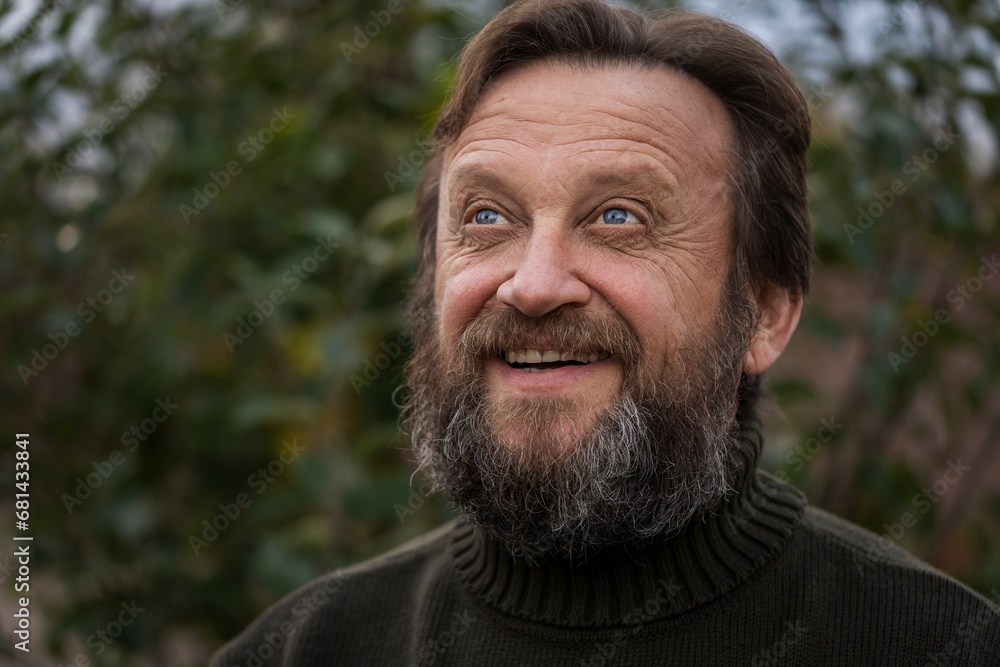 Portrait of a thinking or dreaming or solve problems senior man. Elderly bearded caucasian male in nature. Face bearded male daydream of decision, planning solution and insight of questions Portrait of a thinking or dreaming or solve problems senior man. Elderly bearded caucasian male in nature. Face bearded male daydream of decision, planning solution and insight of questions
