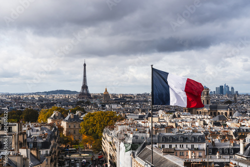 Paris skyline panorama with the Eiffel Tower and French flag photo