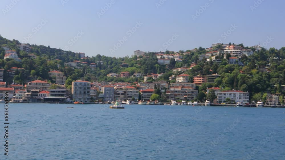 Seascape overlooking the coast of Istanbul. The ship sails and leaves a foamy trail in the water. Seascape overlooking the coast of Istanbul. The ship sails and leaves a foamy trail in the water.