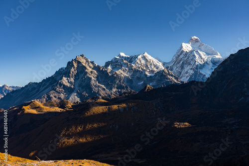 Early morning sunrise in the hImalayas of Nepal with Mt. Kumbhakarna (Jannu HImal) and mountains photo
