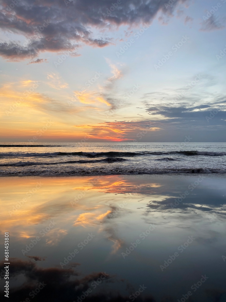 beautiful sunset on Bali. the sky is reflected in the ocean