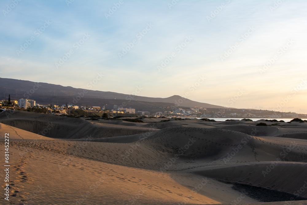 Sand dunes of Maspalomas with a view of the city on Gran Canaria, Spain