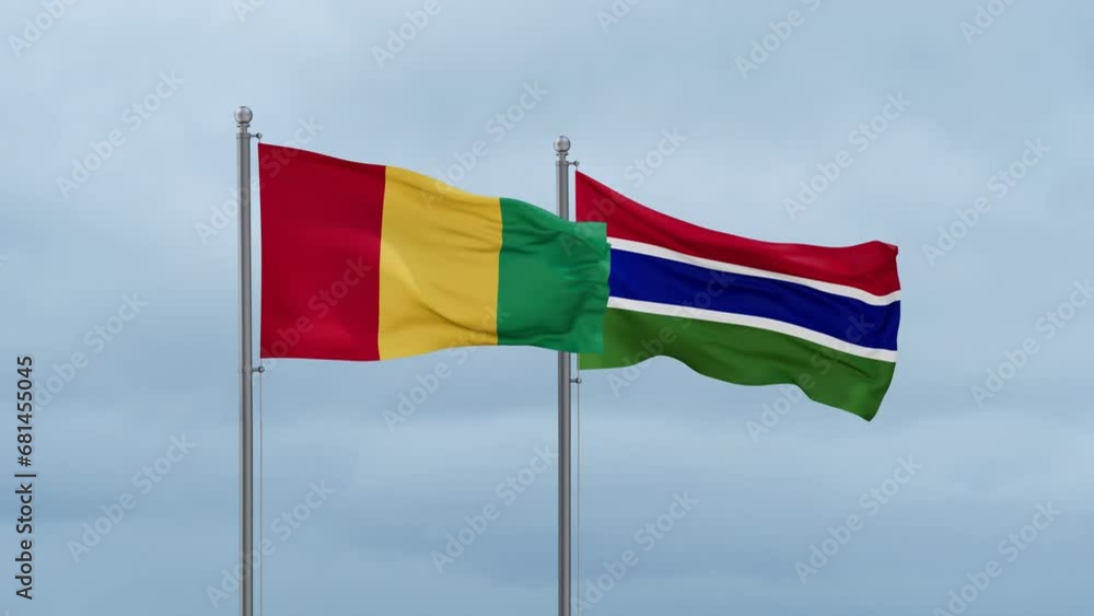 Gambia flag and Republic of Guinea flag waving together on cloudy sky, endless seamless loop, two country relations concept Gambia flag and Republic of Guinea flag waving together on cloudy sky, endless seamless loop, two country relations concept