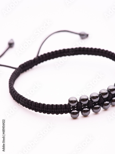 Black hematite handmade bracelet on white background photo
