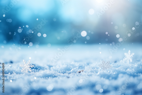 Beautiful and romantic winter background with snowdriff, snowflafe and light bokeh in snowing day