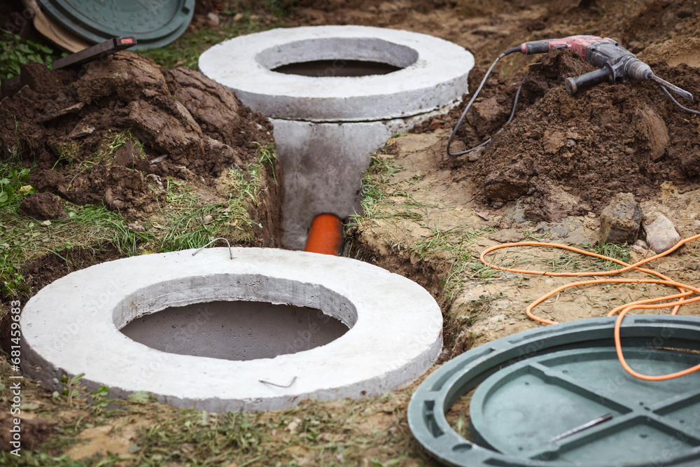 Septic Tank from Concrete Rings Underground. Construction Sewer Well. Install Sewerage Septic Tank with Sewer Hatch or Manhole for Country House.