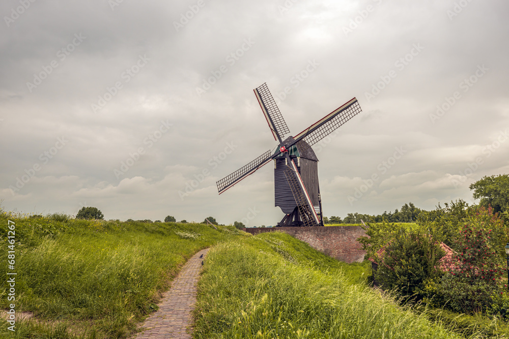 Mill 1 on the fortification wall of the Dutch town of Heusden. T he mill was built in 1971 based on an old example and using old parts from demolished mills. Mill 1 on the fortification wall of the Dutch town of Heusden. T he mill was built in 1971 based on an old example and using old parts from demolished mills.