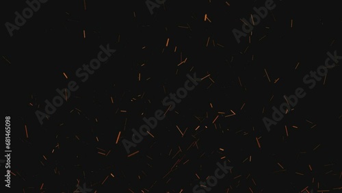 Flying sparks and coals from a fire. abstract glowing particles of burning fire and smoke on a black background, bonfire flares photo