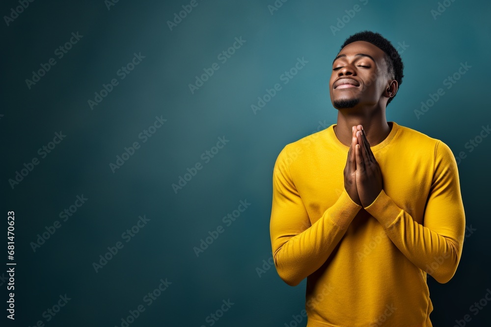 Whispering Prayers: African American Young Man Seeking Grace Whispering Prayers: African American Young Man Seeking Grace
