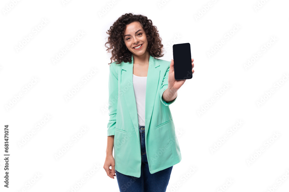 young successful brunette employee of a business company woman dressed in an office jacket holds out her hand in a smartphone young successful brunette employee of a business company woman dressed in an office jacket holds out her hand in a smartphone